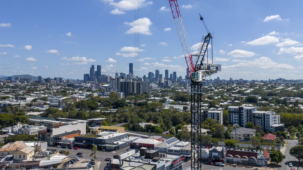 Tower crane on a suburban site at Stones Corner, with Brisbane's CBD beyond